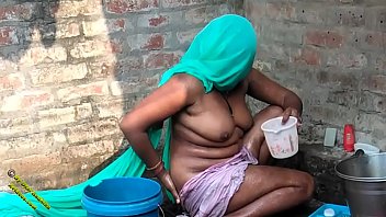 Desi Radhika’s Steamy Village Bath In Hindi